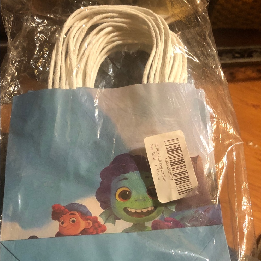 Unlisted kids gift bag with blue, green, purple and white 12 bags